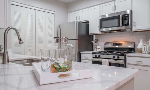 a kitchen with white cabinets