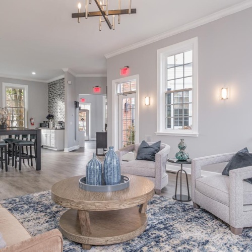 a living room with a chandelier and a couch