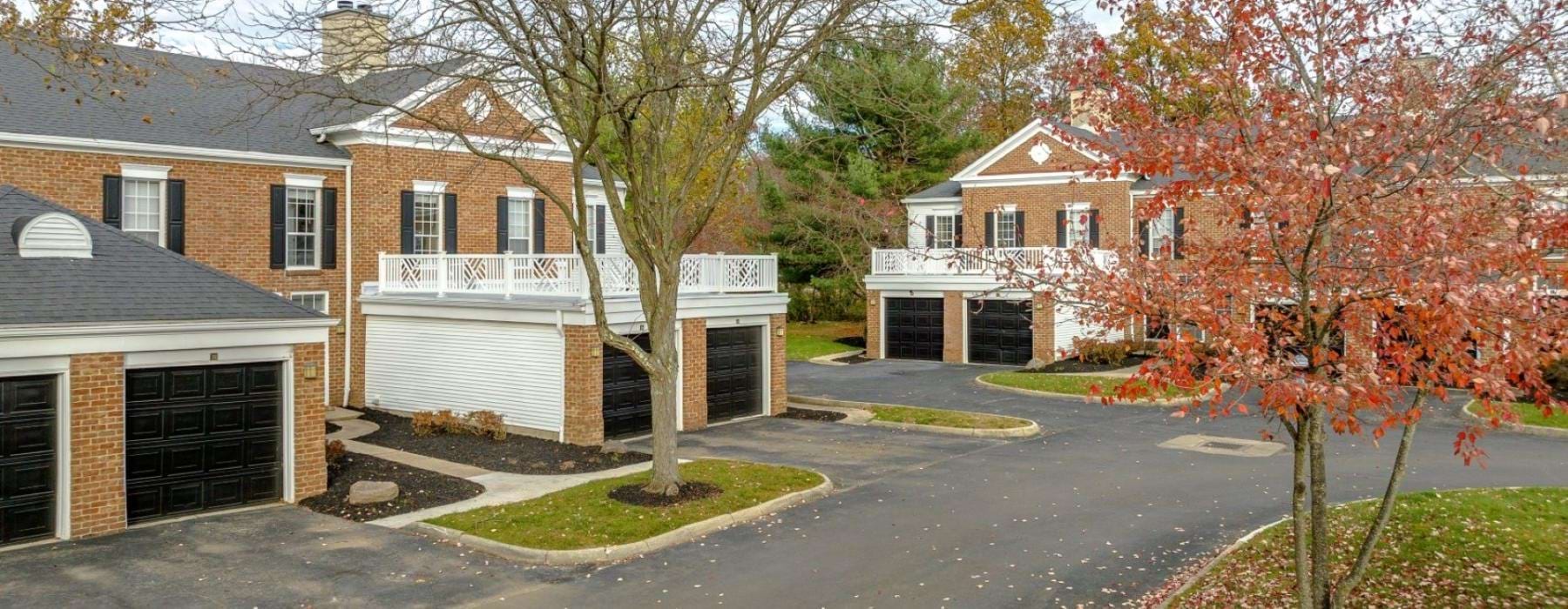 a neighborhood street with houses and trees