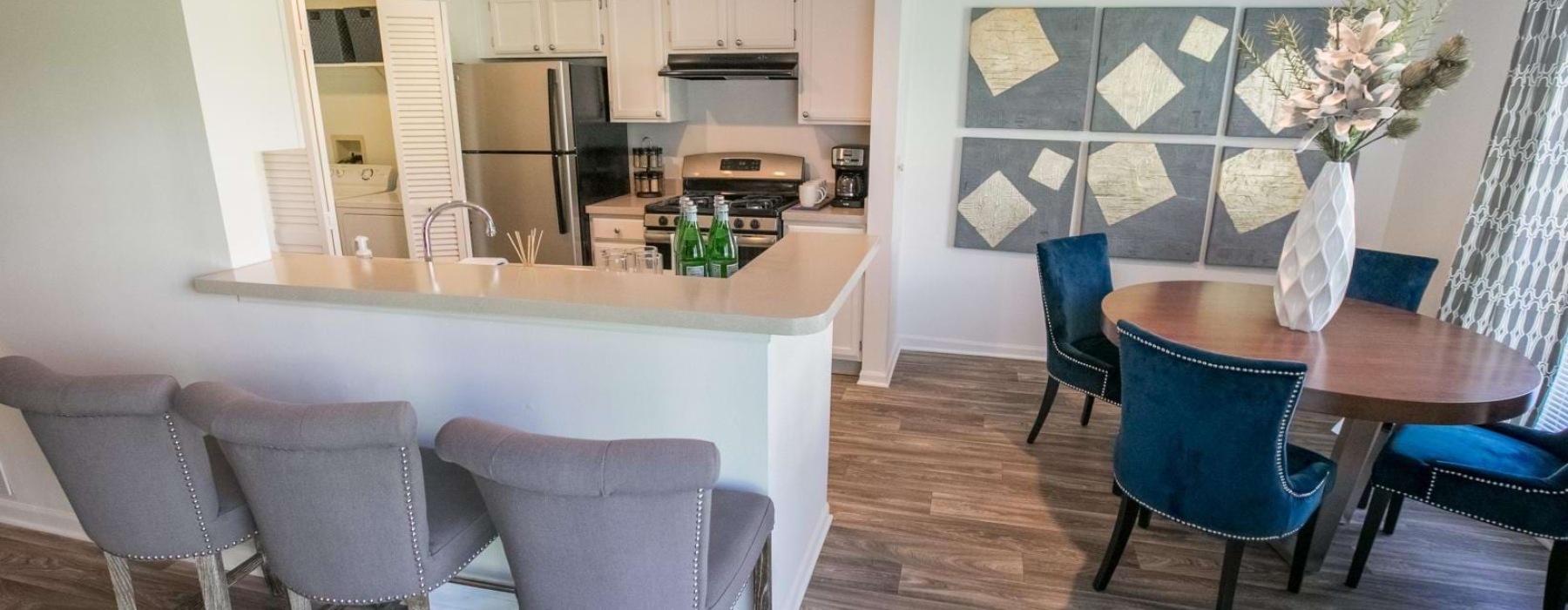 a kitchen with a dining table and chairs