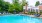 a swimming pool with chairs around it