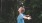 a person in a blue dress in the woods