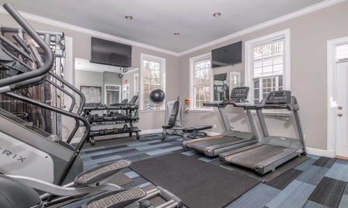 a room with treadmills and treadmills